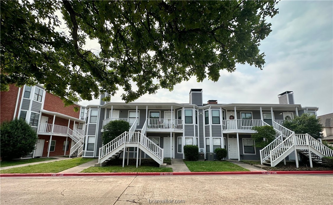 4441 Old College Road, Unit 4202 Bryan, TX 77801 - Photo 1 of 1 a front view of a house with a yard