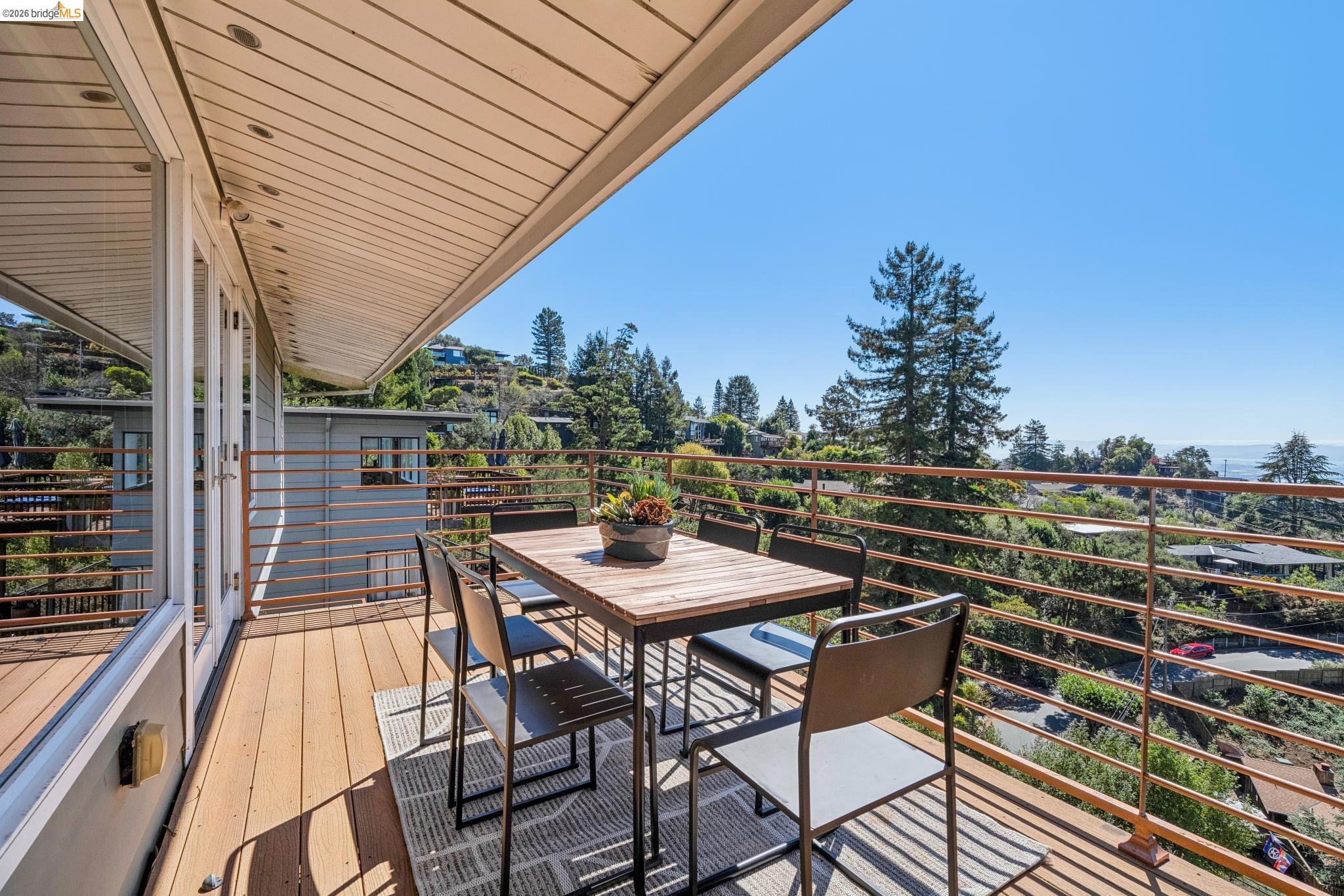 1394 Queens Road Berkeley, CA 94708 - Photo 22 of 63 Expansive outdoor deck with wood-finish flooring and a metal railing system