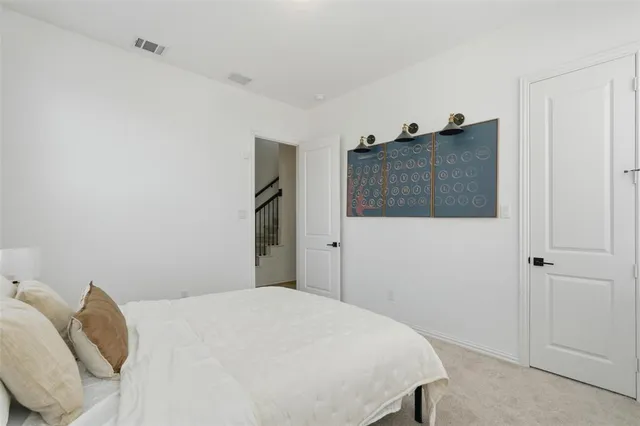 a bedroom with a bed and a cabinets
