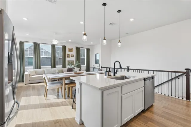 a kitchen with counter top space and sink