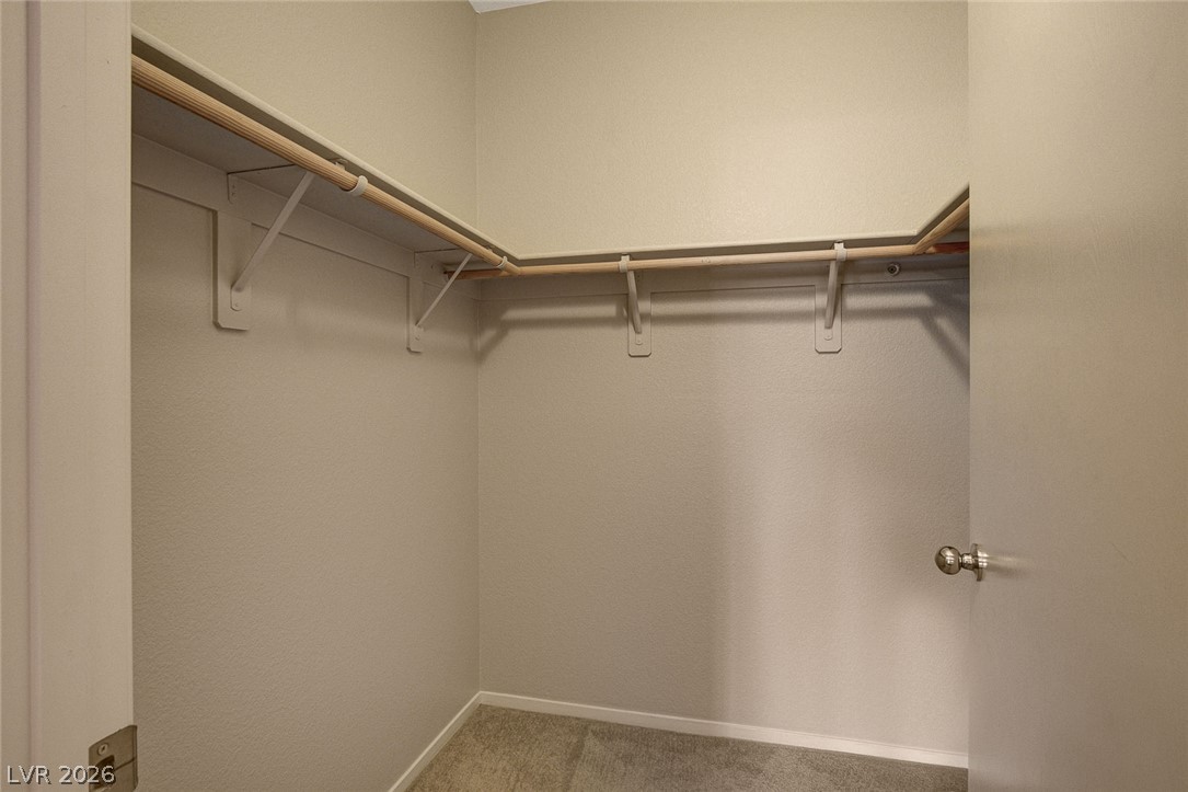9050 West Warm Springs Road, Unit 1034 Las Vegas, NV 89148 - Photo 10 of 17 A well-organized closet offers ample storage and shelving for a streamlined living.
