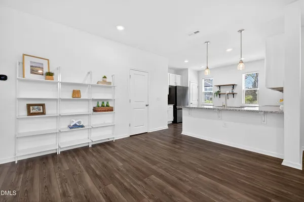 a view of kitchen with wooden floor and window