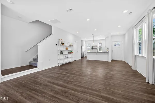 a view of a kitchen with wooden floor