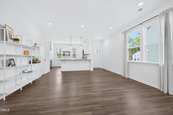 a view of kitchen with wooden floor and window