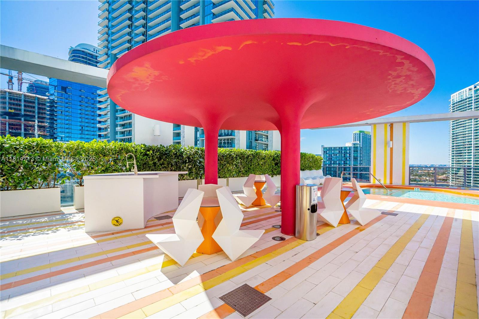 31 Southeast 6th Street, Unit 2205 Miami, FL 33131 - Photo 17 of 25 a view of outdoor kitchen and dining area