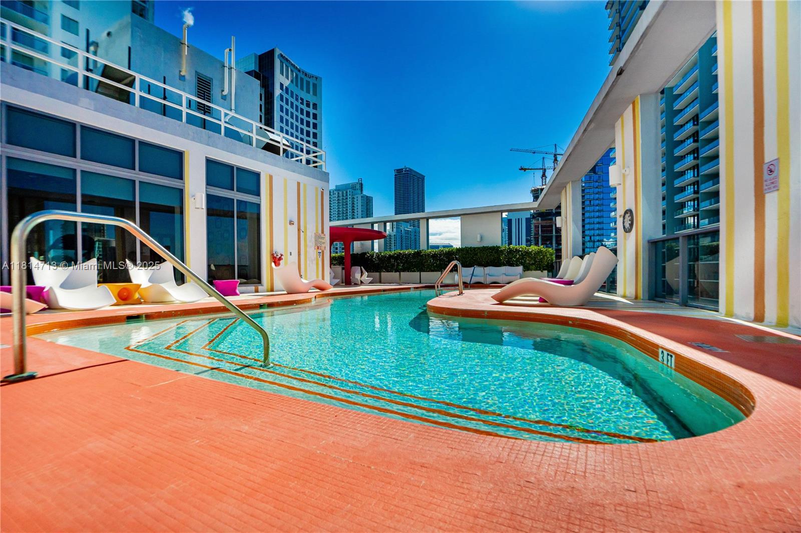 31 Southeast 6th Street, Unit 2205 Miami, FL 33131 - Photo 20 of 25 a view of swimming pool with outdoor seating