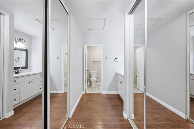 a spacious bathroom with a double vanity sink and mirror