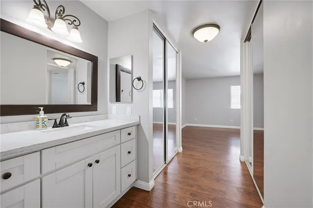 a white toilet sitting next to a bath tub