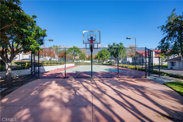 a view of a swimming pool and lounge chairs