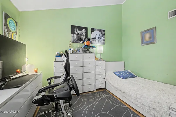 a bedroom with a bed and furniture