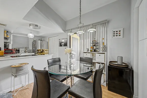a dining room with furniture and window