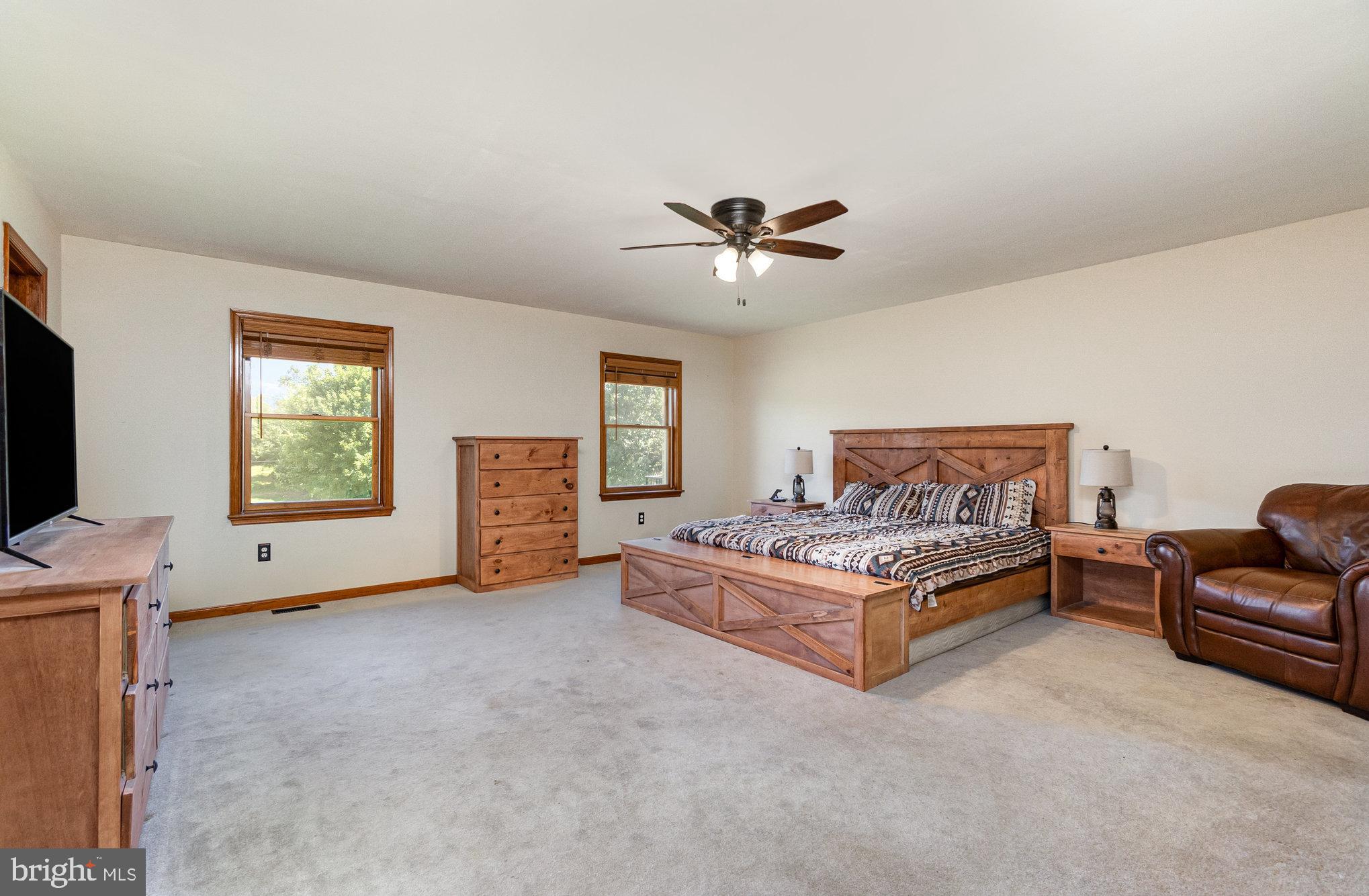 4816 Amos Road White Hall, MD 21161 - Photo 15 of 56 a living room with furniture and a flat screen tv