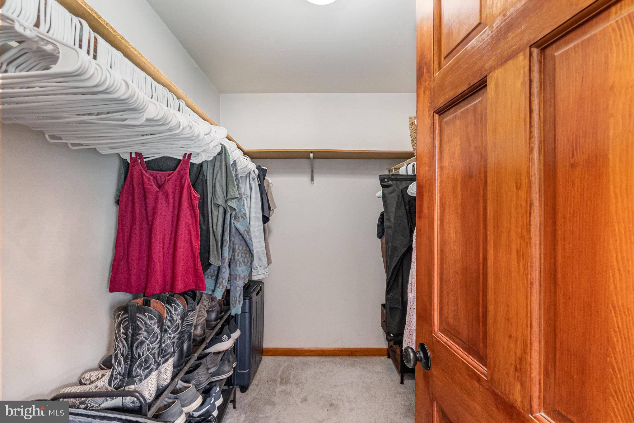4816 Amos Road White Hall, MD 21161 - Photo 18 of 56 a view of walk in closet with clothes