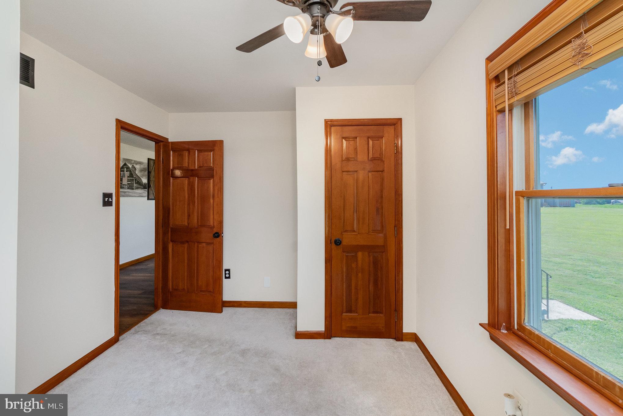4816 Amos Road White Hall, MD 21161 - Photo 23 of 56 an empty room with chandelier fan