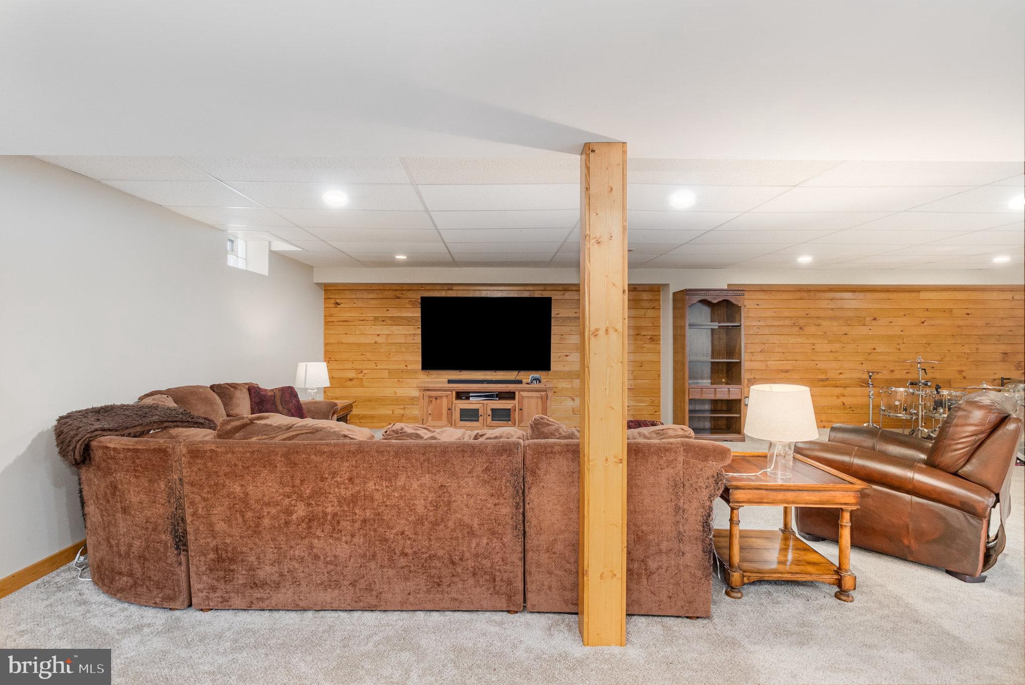 4816 Amos Road White Hall, MD 21161 - Photo 27 of 56 a living room with furniture and a flat screen tv