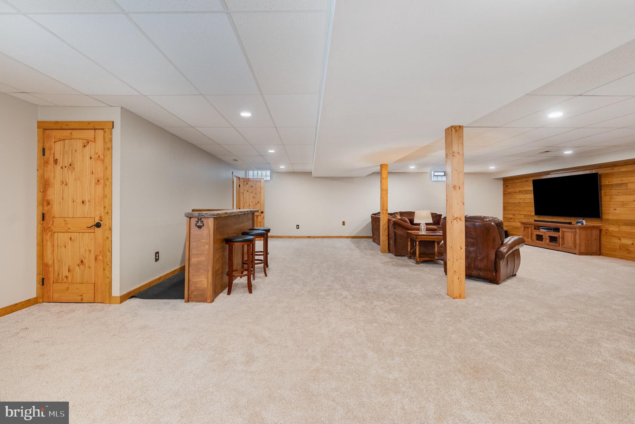 4816 Amos Road White Hall, MD 21161 - Photo 33 of 56 a room with furniture and a flat screen tv