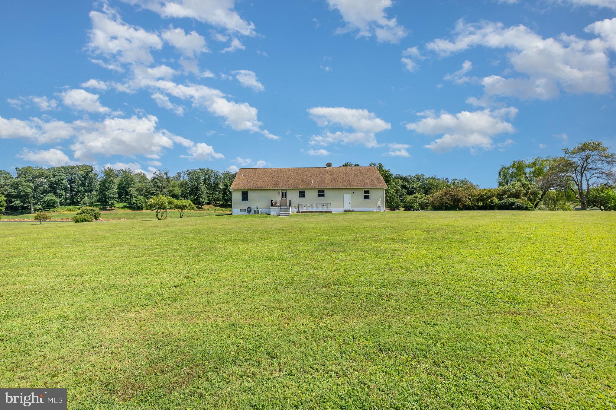 4816 Amos Road White Hall, MD 21161 - Photo 39 of 56 a view of a lake with houses in the back
