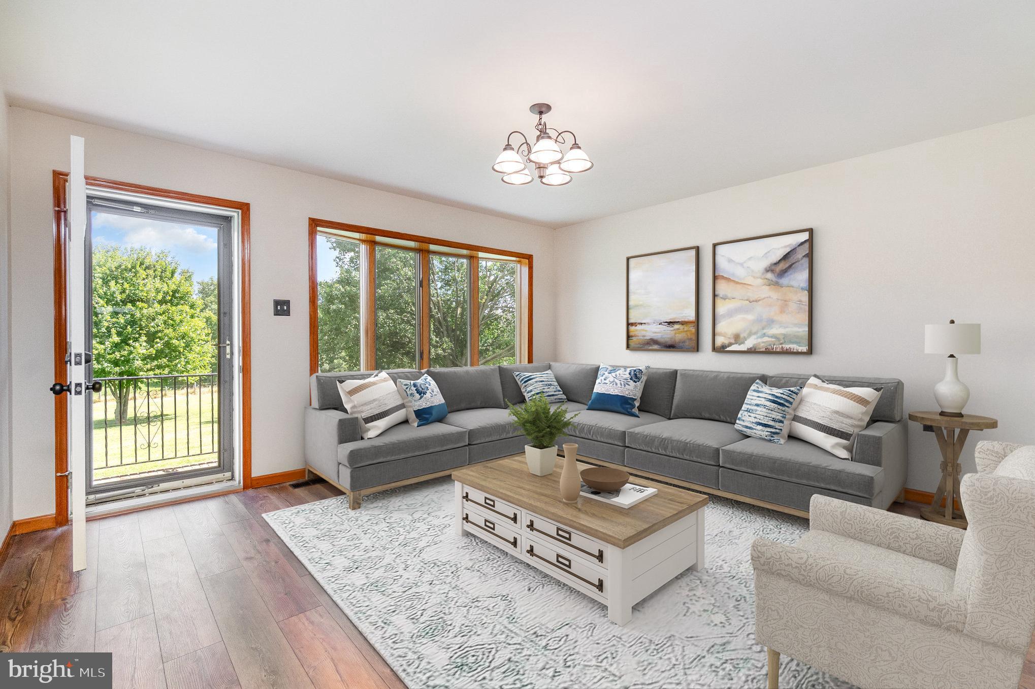 4816 Amos Road White Hall, MD 21161 - Photo 6 of 56 a living room with furniture and a large window