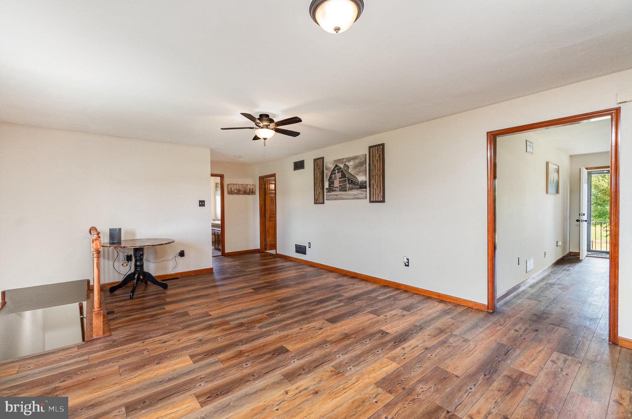 4816 Amos Road White Hall, MD 21161 - Photo 7 of 56 a view of empty room with wooden floor
