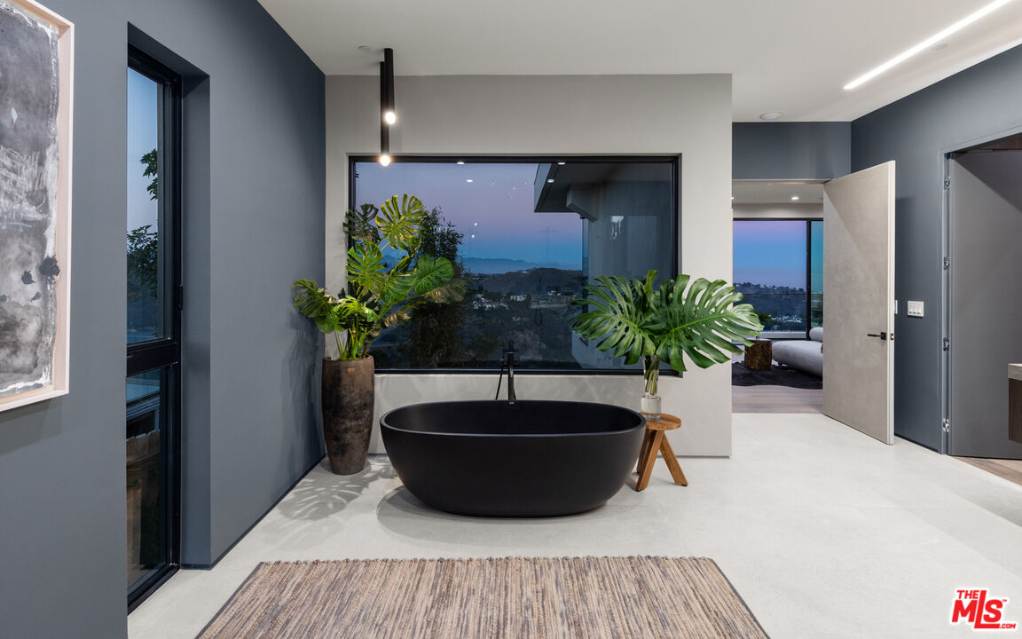 1640 Stradella Road Los Angeles, CA 90077 - Photo 11 of 25 a room with a potted plant and a sink