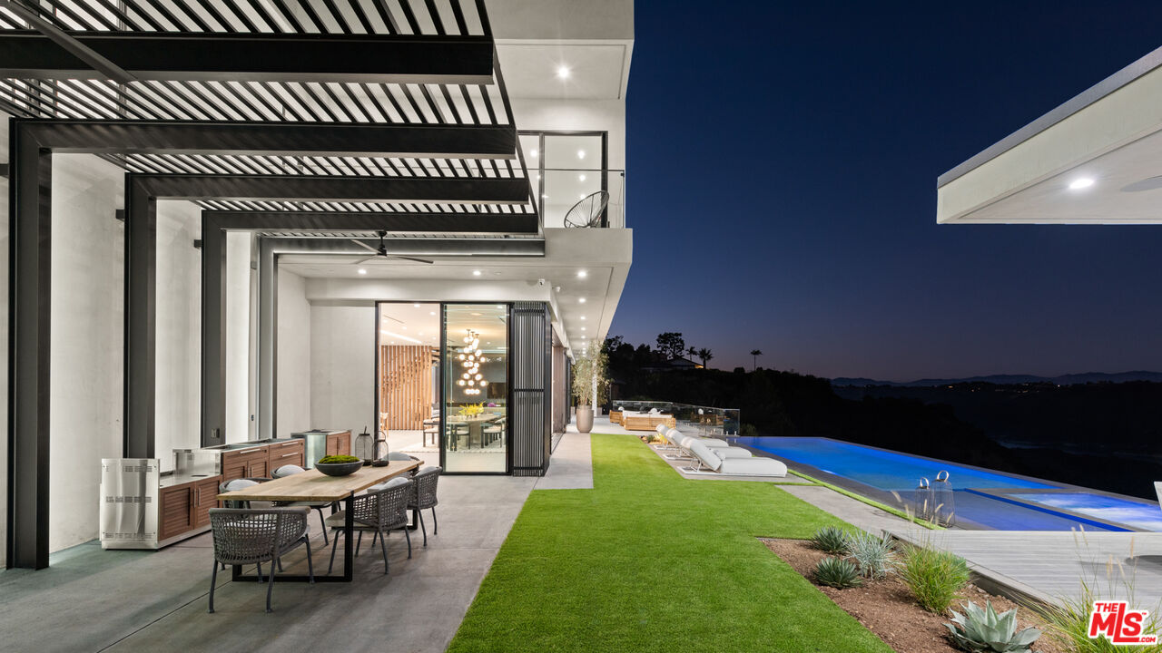 1640 Stradella Road Los Angeles, CA 90077 - Photo 23 of 25 a backyard of a house with outdoor seating