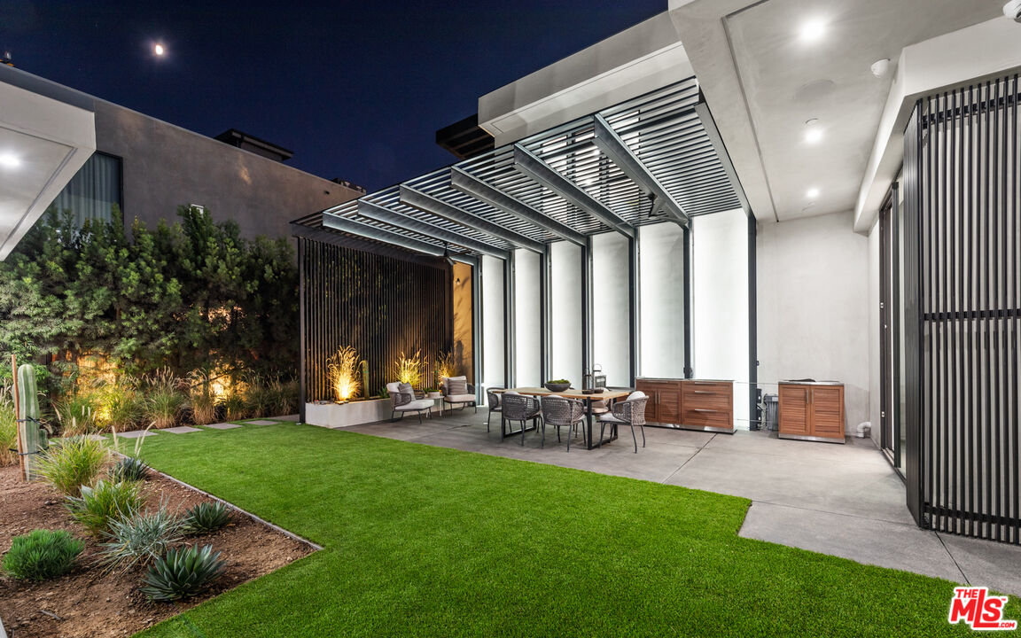 1640 Stradella Road Los Angeles, CA 90077 - Photo 24 of 25 a view of a porch with chairs and backyard