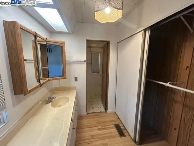 a bathroom with a tub and a sink