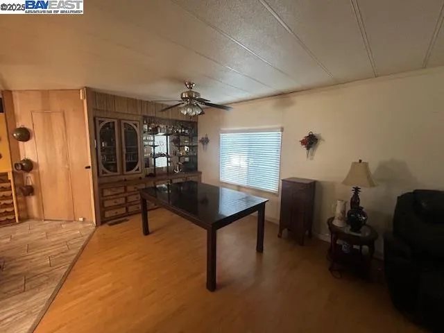 a room with furniture pool table and windows