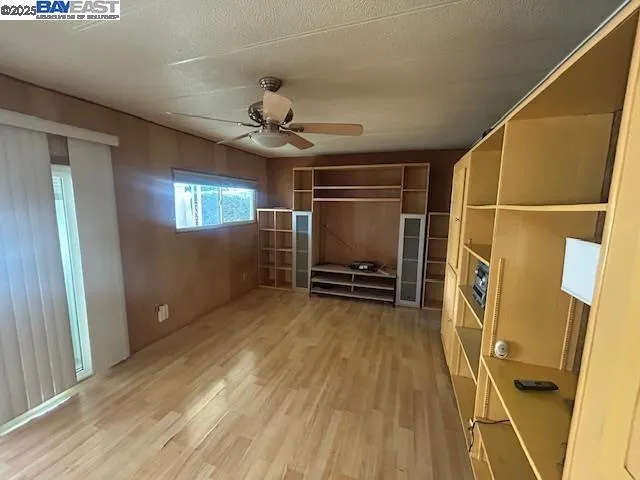 a view of an empty room with a fireplace