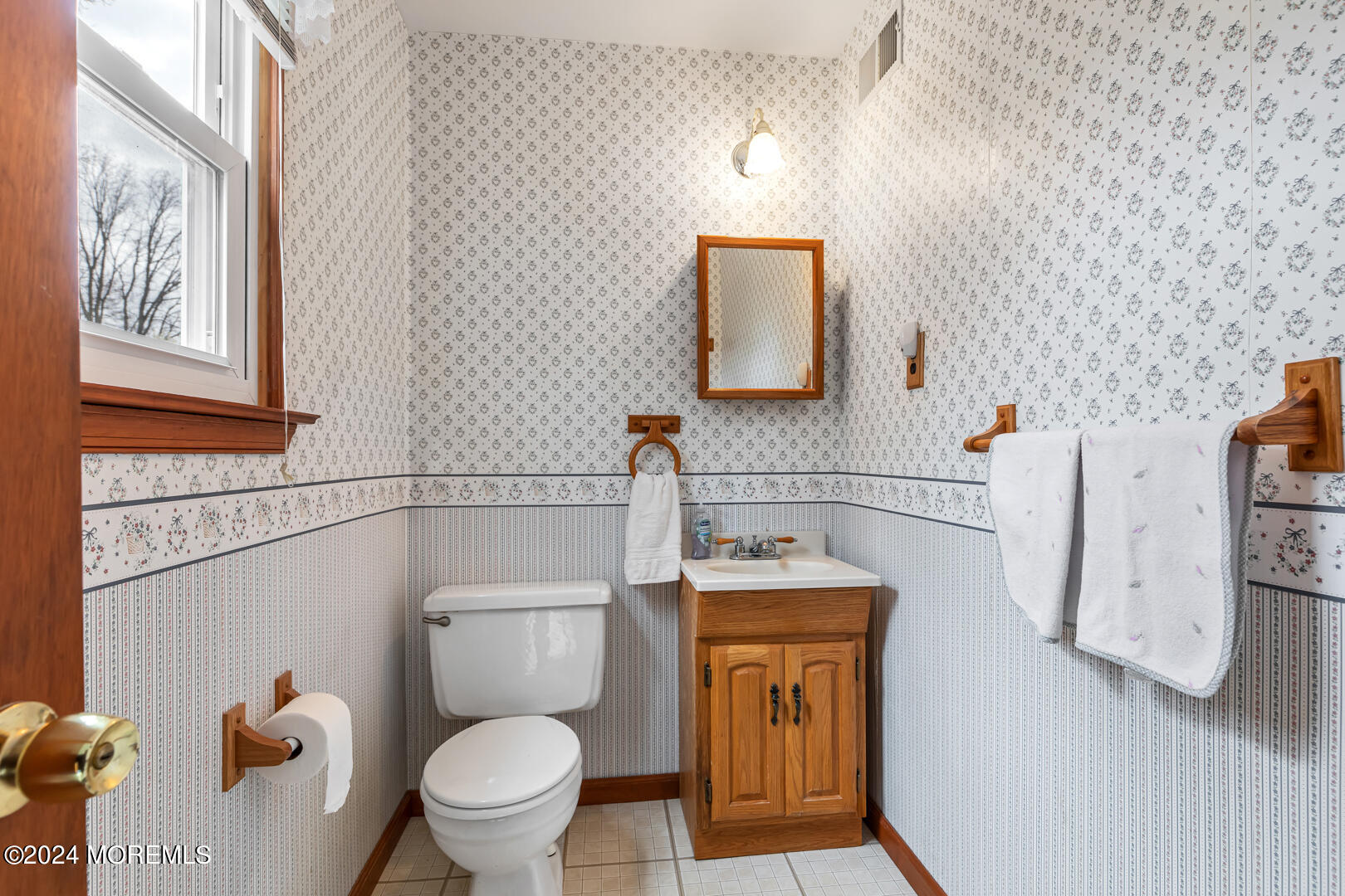 12 Bunkerhill Road Hazlet, NJ 07730 - Photo 15 of 27 a bathroom with a toilet a sink and mirror