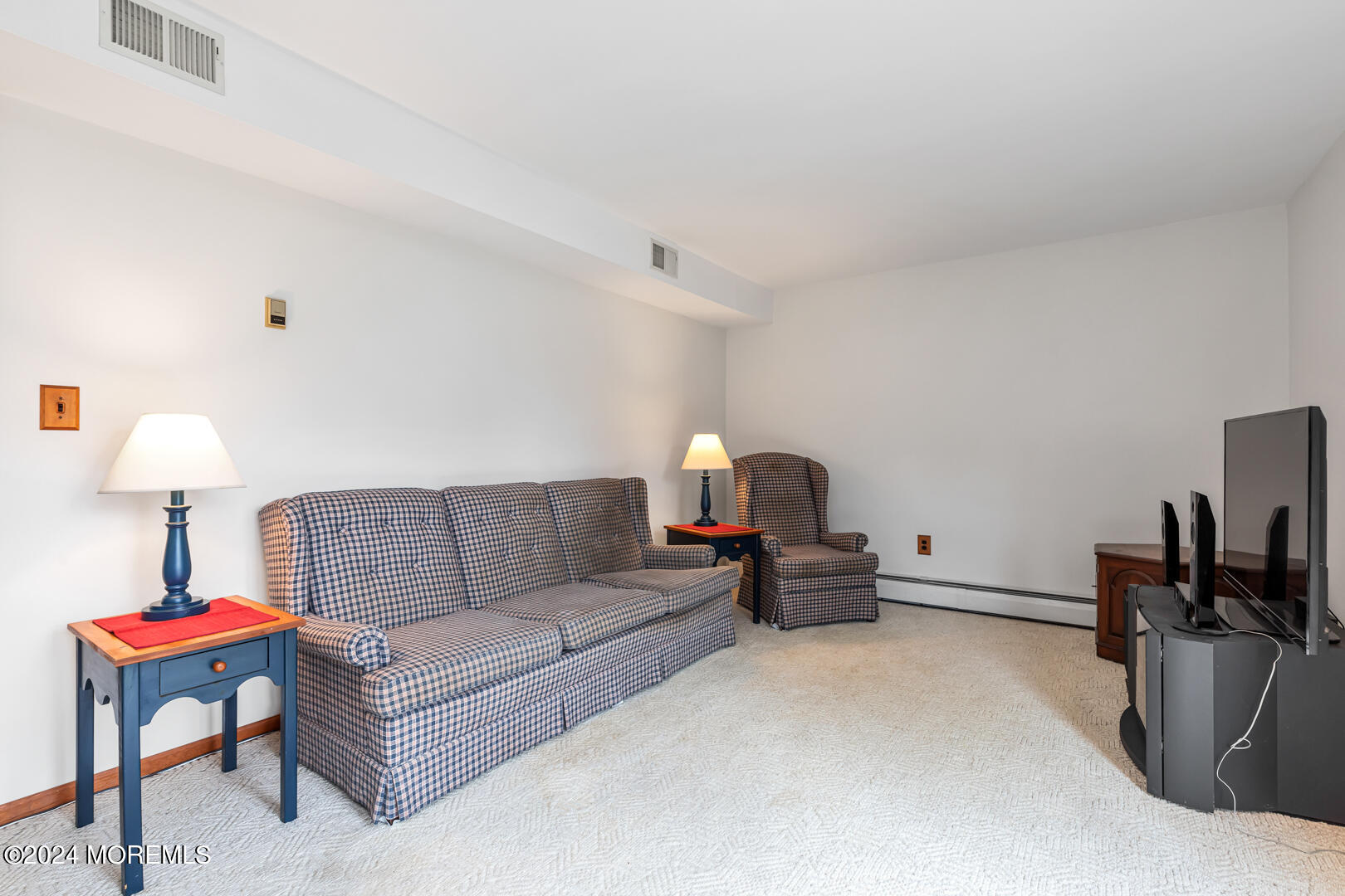 12 Bunkerhill Road Hazlet, NJ 07730 - Photo 16 of 27 a living room with furniture and a lamp