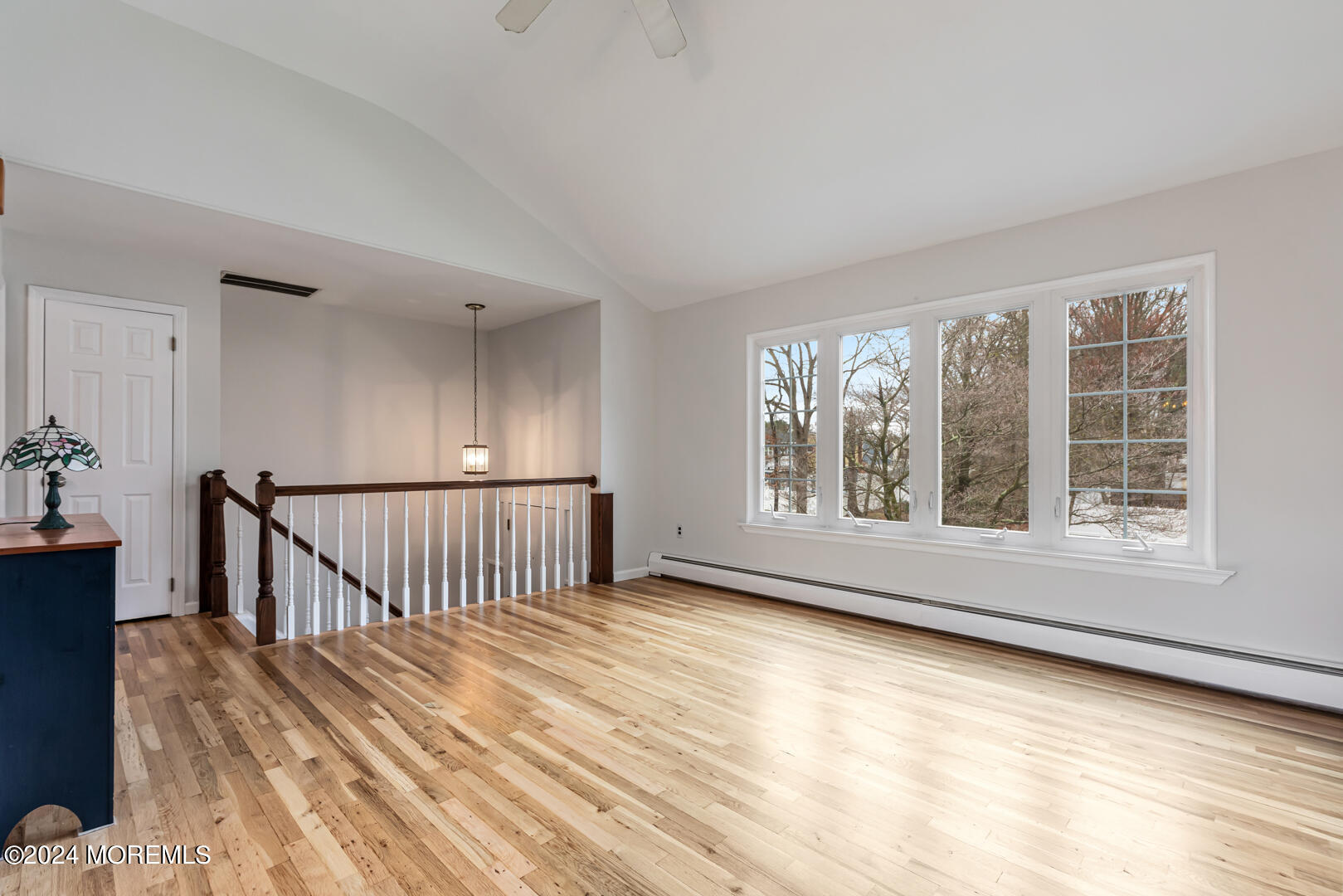12 Bunkerhill Road Hazlet, NJ 07730 - Photo 3 of 27 a view of an empty room with wooden floor and a window