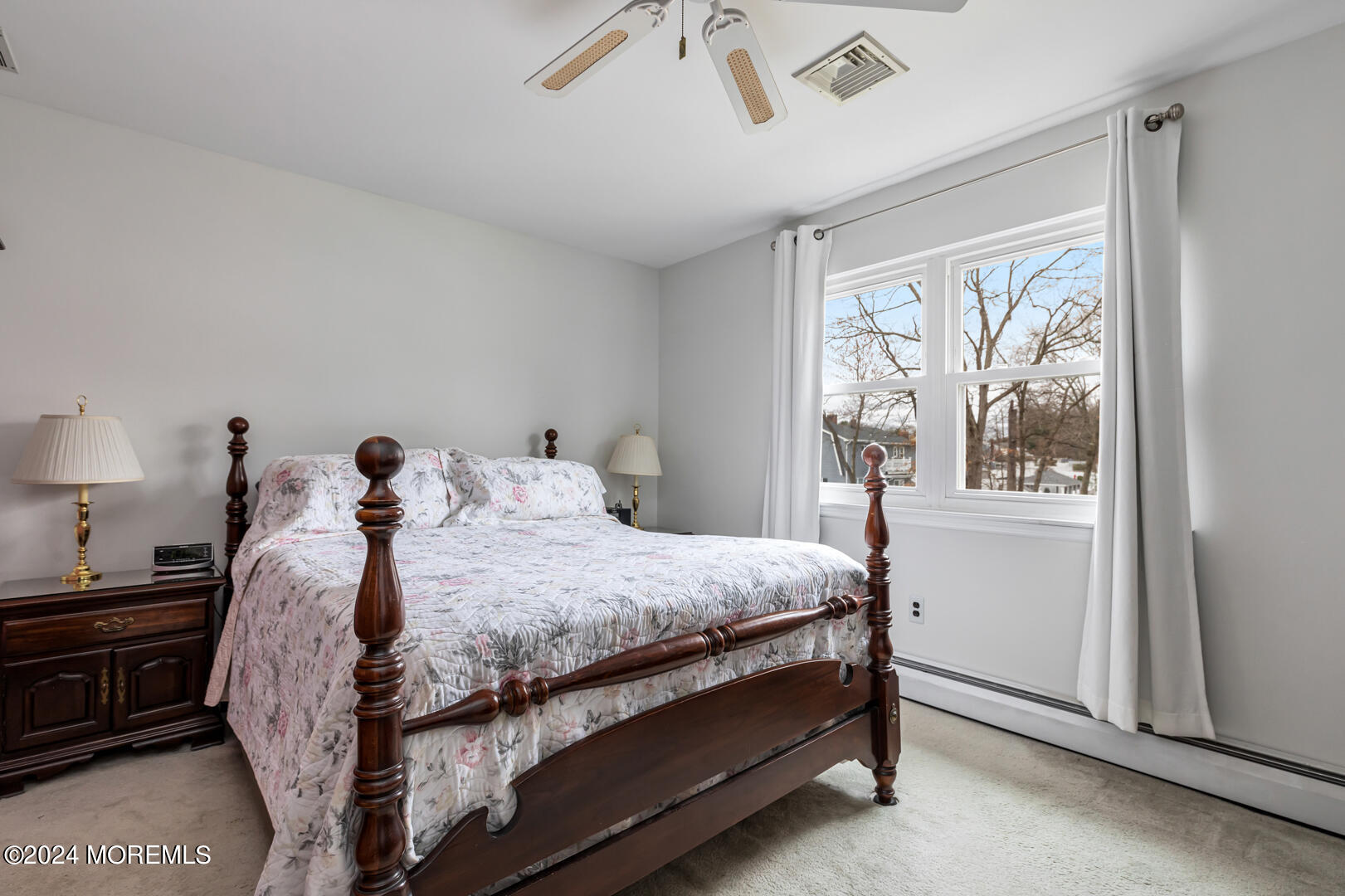 12 Bunkerhill Road Hazlet, NJ 07730 - Photo 10 of 27 a bed sitting in a bedroom next to a window