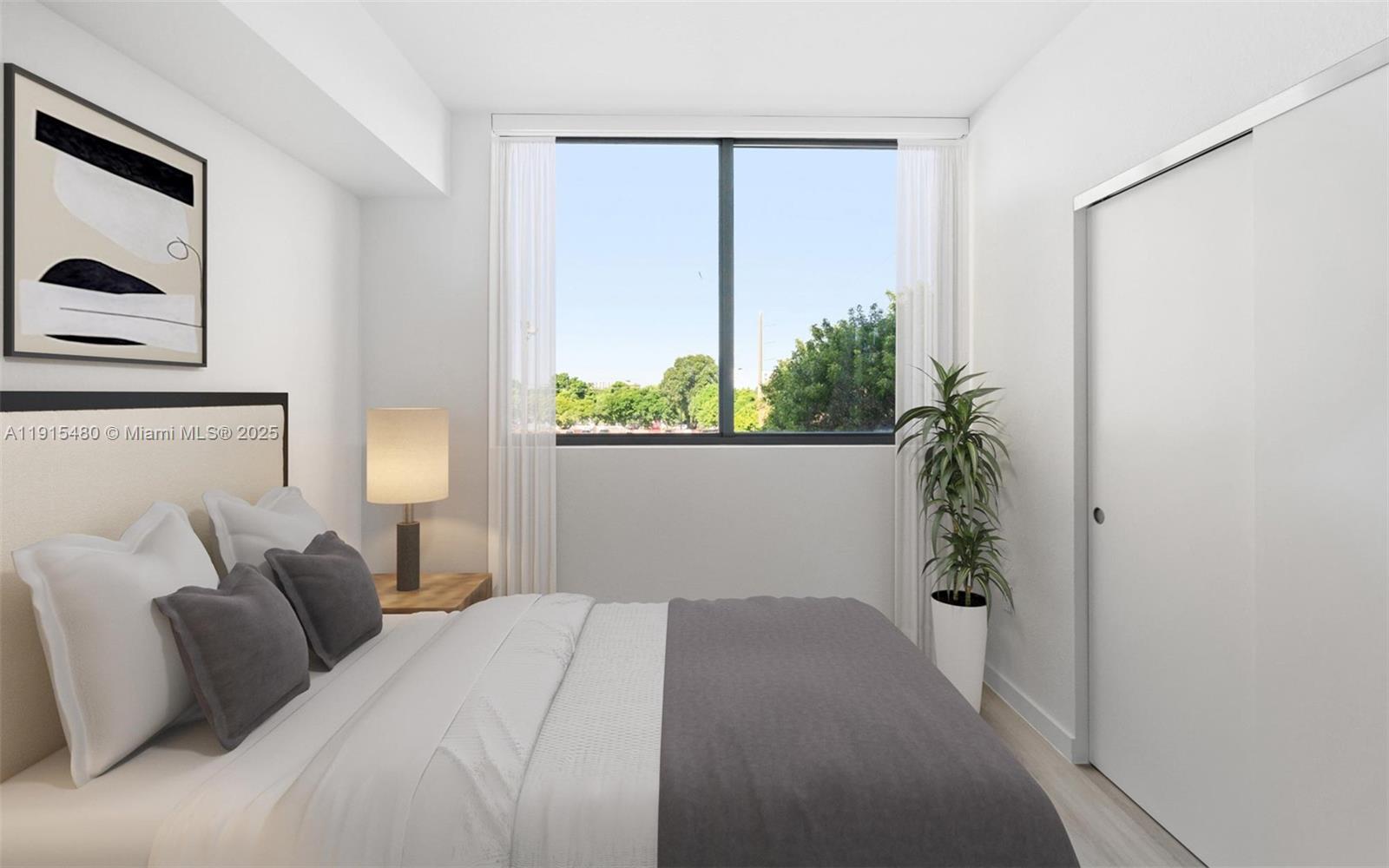 3830 Northwest 11th Street, Unit STUDIO Miami, FL 33126 - Photo 15 of 20 a bedroom with a bed and a window