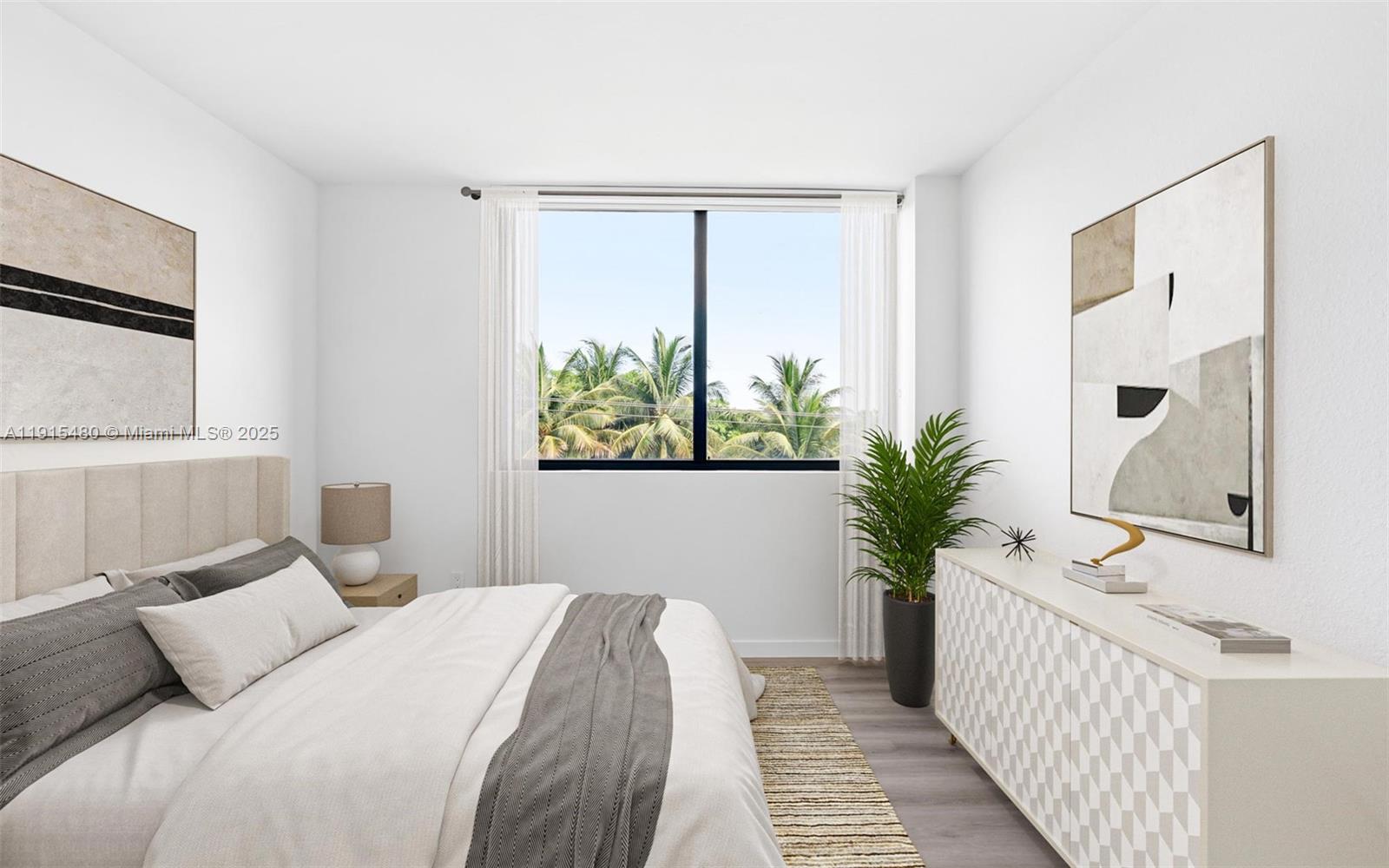 3830 Northwest 11th Street, Unit STUDIO Miami, FL 33126 - Photo 16 of 20 a bedroom with a large bed and a window