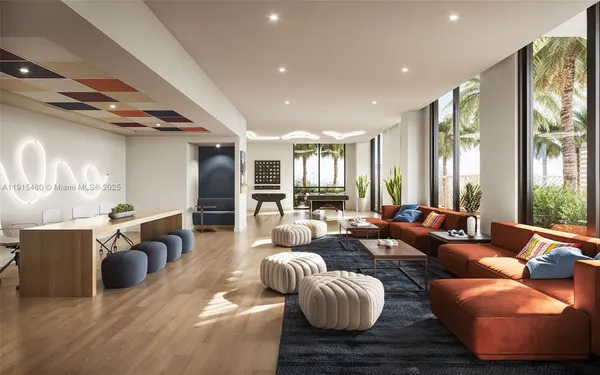 a living room with furniture kitchen view and a large window