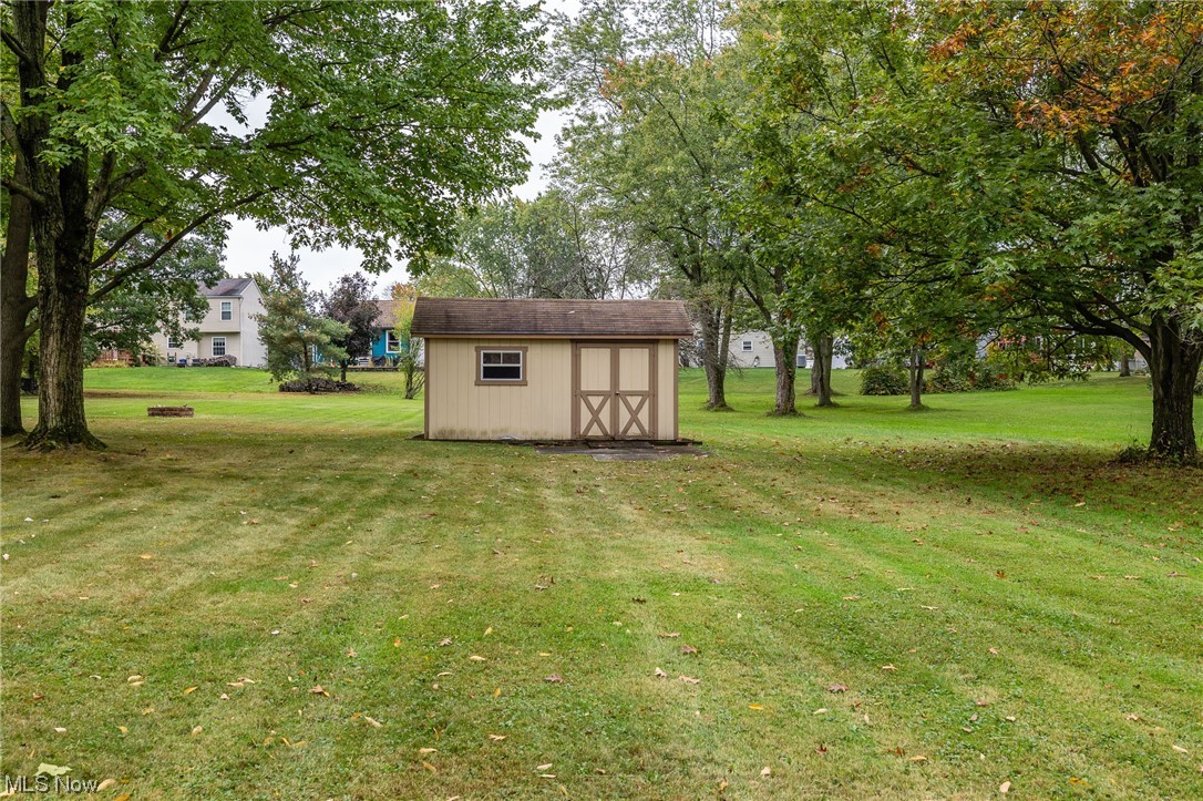 14179 Drake Road Strongsville, OH 44136 - Photo 25 of 33 View of yard featuring a storage unit
