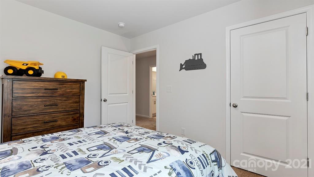 332 Gaines Road Clover, SC 29710 - Photo 28 of 32 a bedroom with a bed and a dresser