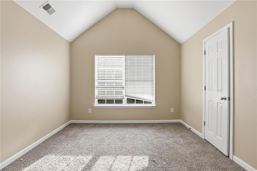 4968 Locherby Drive Fairburn, GA 30213 - Photo 26 of 39 an empty room with a window