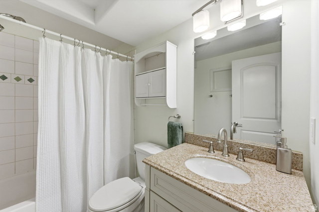 7235 Viansa Court Midvale, UT 84047 - Photo 27 of 43 Full bath with vanity and shower / bath combo