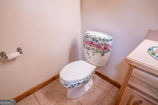 a bathroom with a toilet a sink and a shower