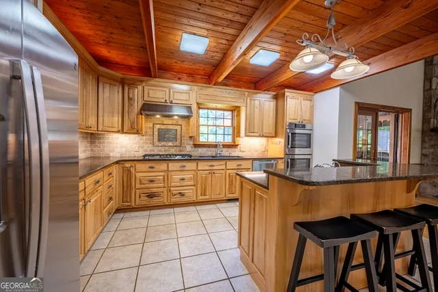 a view of a house with a yard and stairs