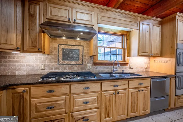 a front view of a house with a yard table and chairs