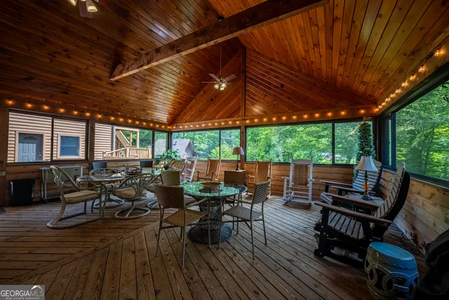 a view of a lush green hillside and a mountain