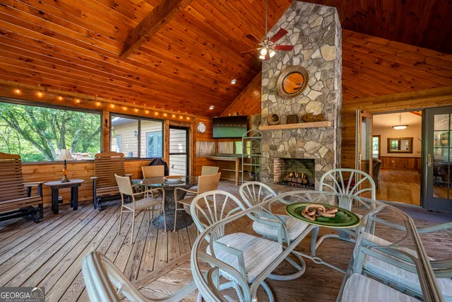 a view of a field with a tree in it