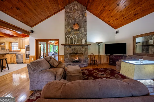an aerial view of a residential houses with outdoor space and street view