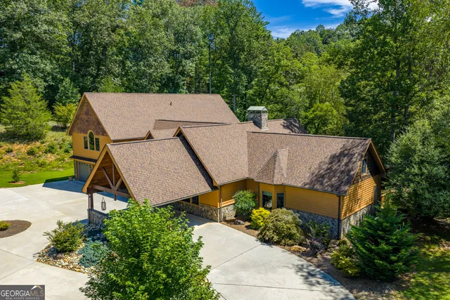 a bathroom with a sink mirror vanity and toilet
