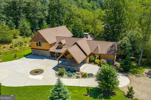 a kitchen with granite countertop a sink cabinets and stainless steel appliances