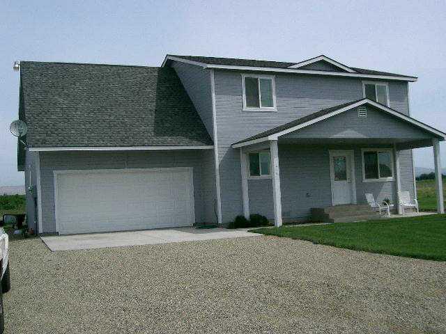 2481 Van Belle Road Outlook, WA 98938 - Photo 1 of 7 a front view of a house with a yard and garage