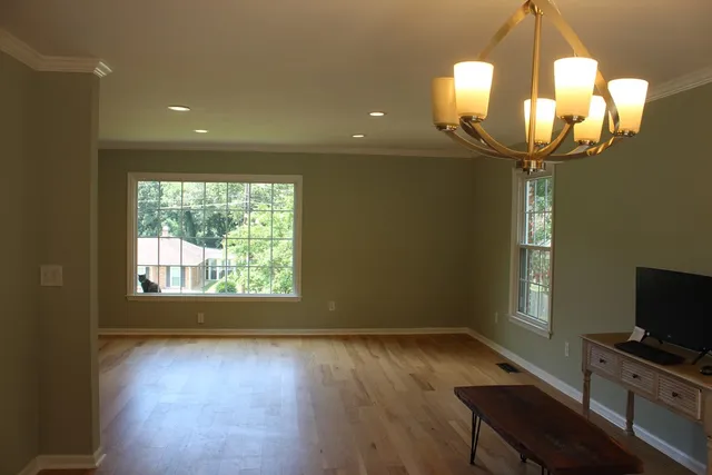 a room with window and furniture